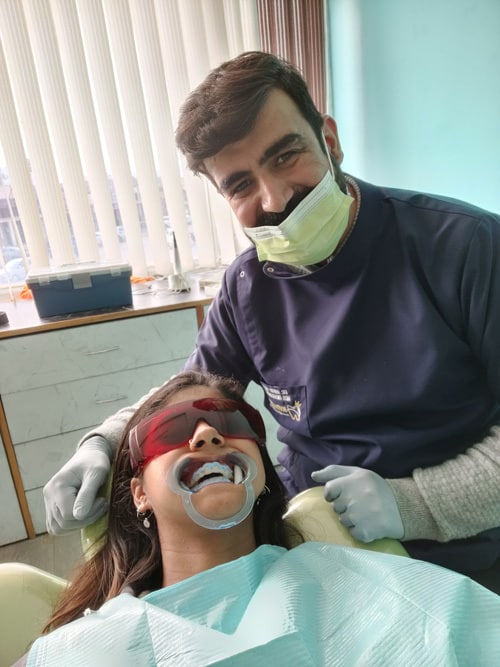 The dentist and the patient have completed all the necessary preparations for the teeth whitening procedure.